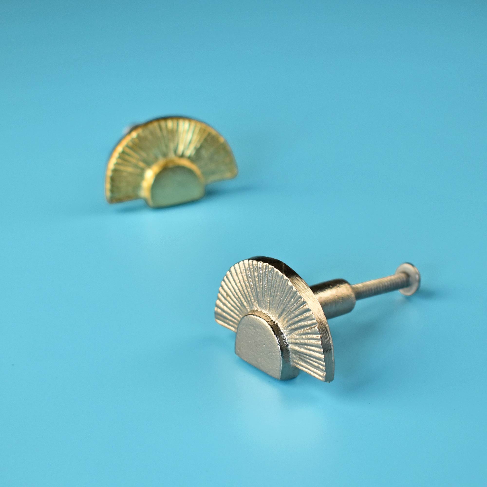 gold and silver decorative dresser knob