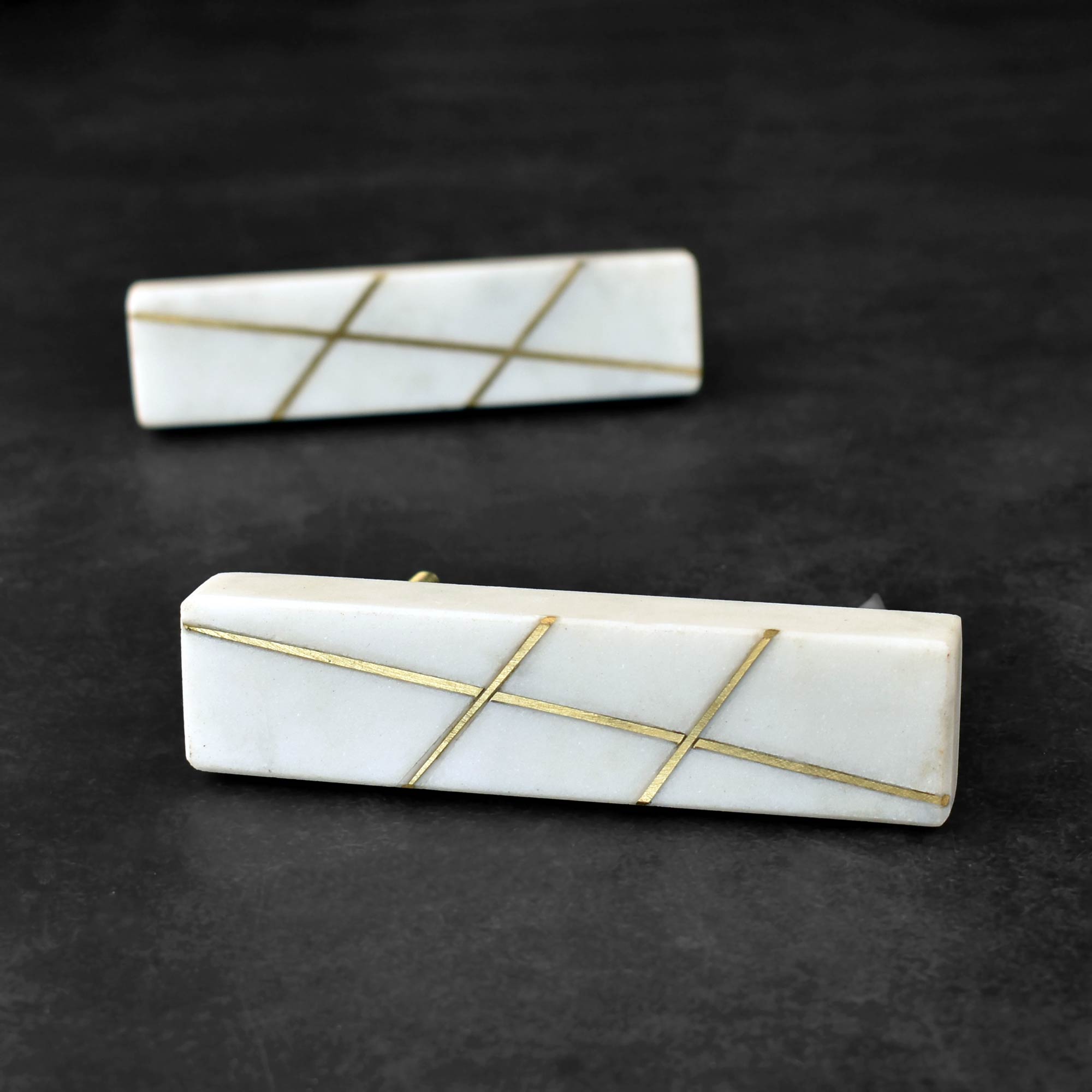 stone cupboard handle with brass inlay