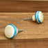 white and blue bone knob