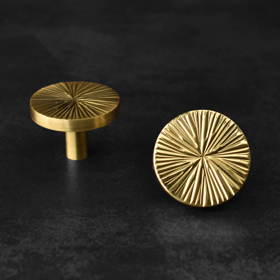 brass circular knobs with a radial design